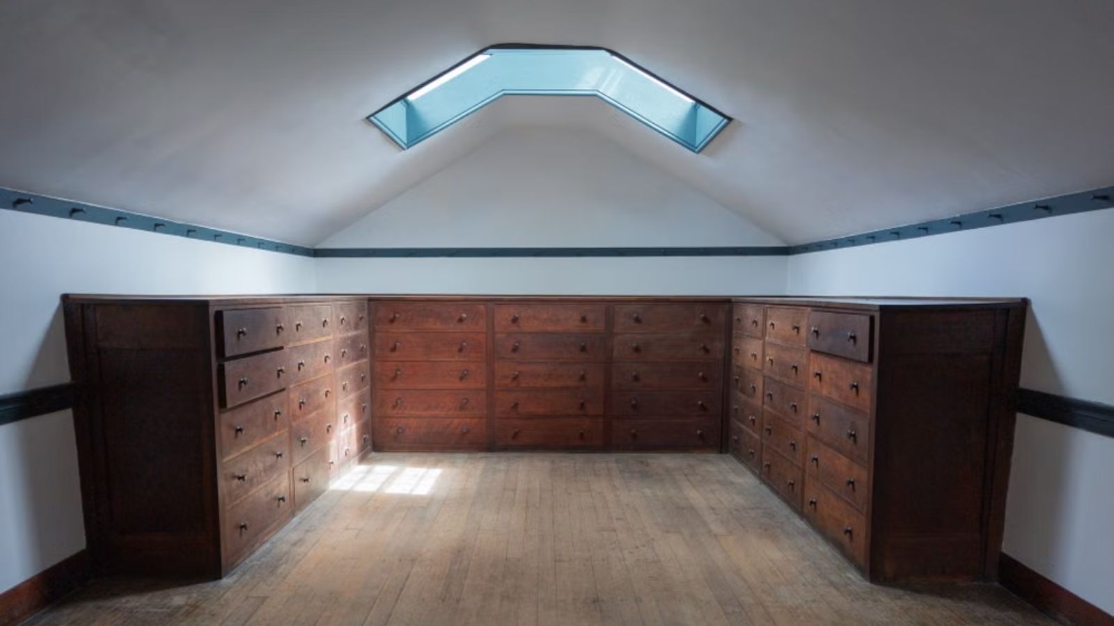 His Plan to Rent an Attic Room for College Hit a Wall When His Family Pushed Him to Keep Living at Home A bright attic room with wooden cabinets