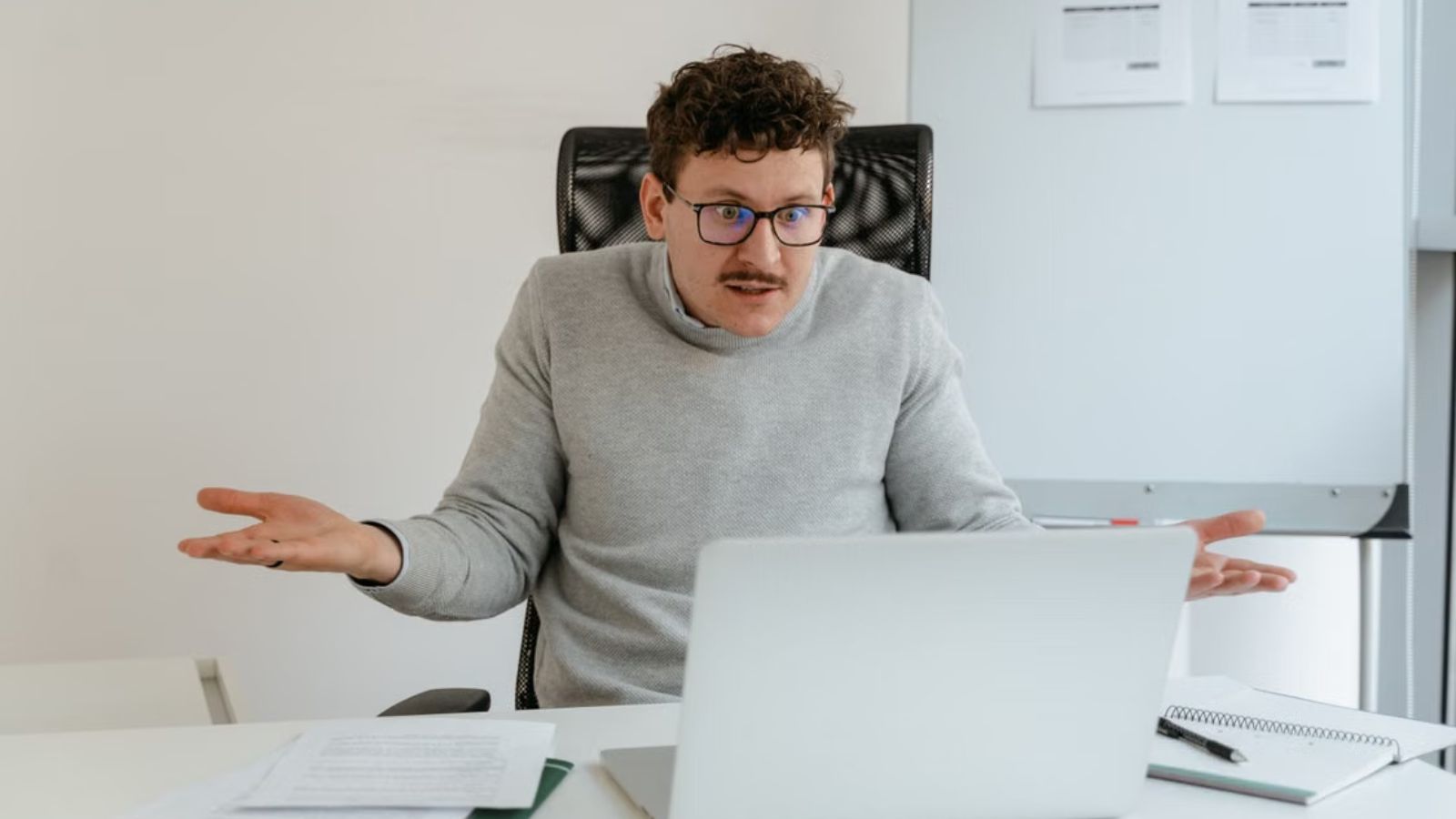A QA Employee Couldnt Find Her File, And When He Did, He Had to Explain Why an Extremely Long Filename Was the Problem Man feeling confused while looking at his laptop screen
