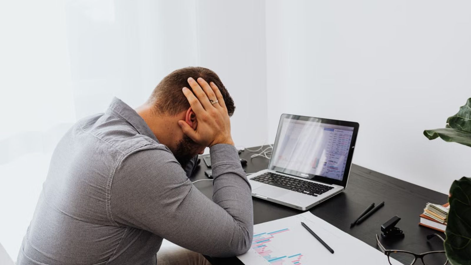 He Thought Decades of Company Loyalty Would Pay Off—Until He Realized He Was Just Being Exploited Male employee feeling stressed at work