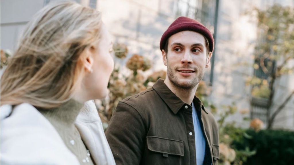 Man and woman talking outdoors