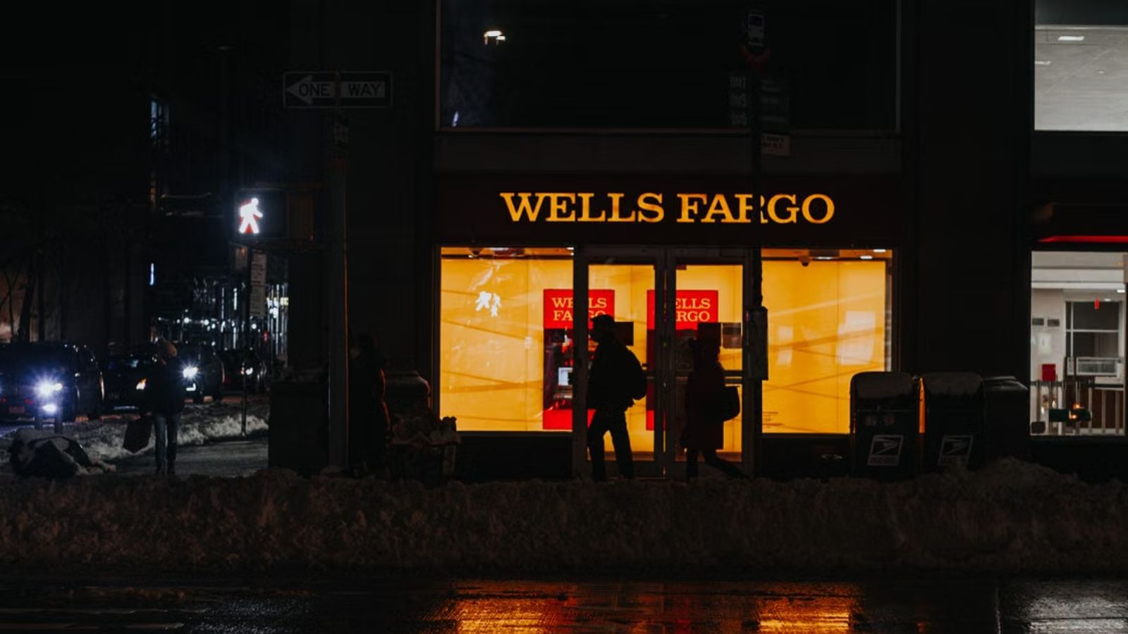 His Father Warned the Company About a Major Problem—They Laid Him Off Instead of Listening, So His Son Made Sure Theyd Regret It Nighttime view of the Wells Fargo bank with lighted up logo