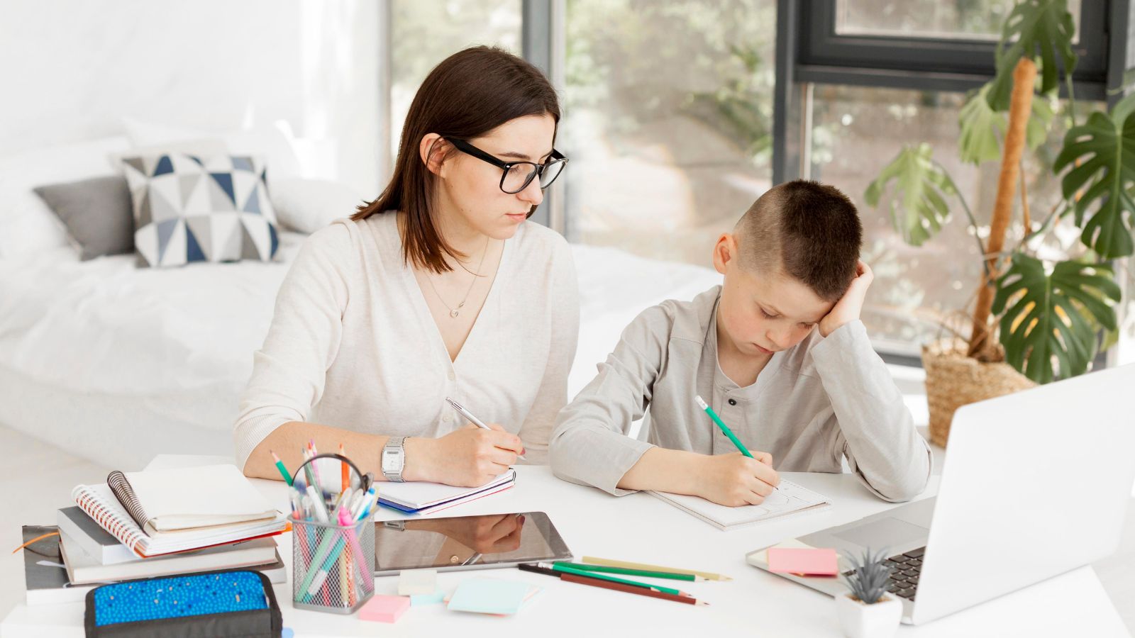Her Family Pressured Her to Tutor Her Nephew — She Said No, And The Guilt of Disappointing Them Has Been Hard to Shake Woman teaching a young boy with his homework