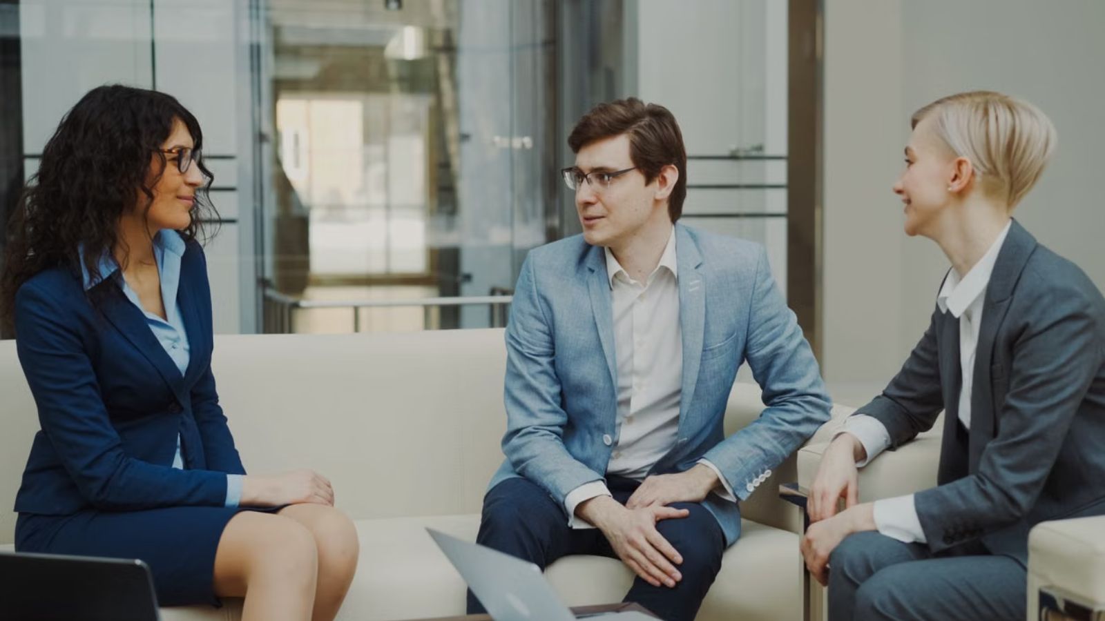 Employees in business attire having a meeting in the office