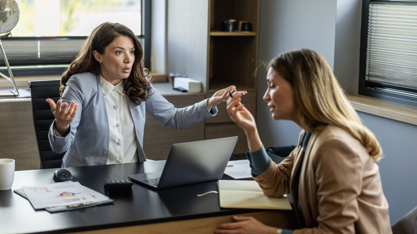 Employee Refuses Excessive Unpaid Overtime, but Her Coworkers Say She Isn’t Being a Team Player angry boss yelling at employee