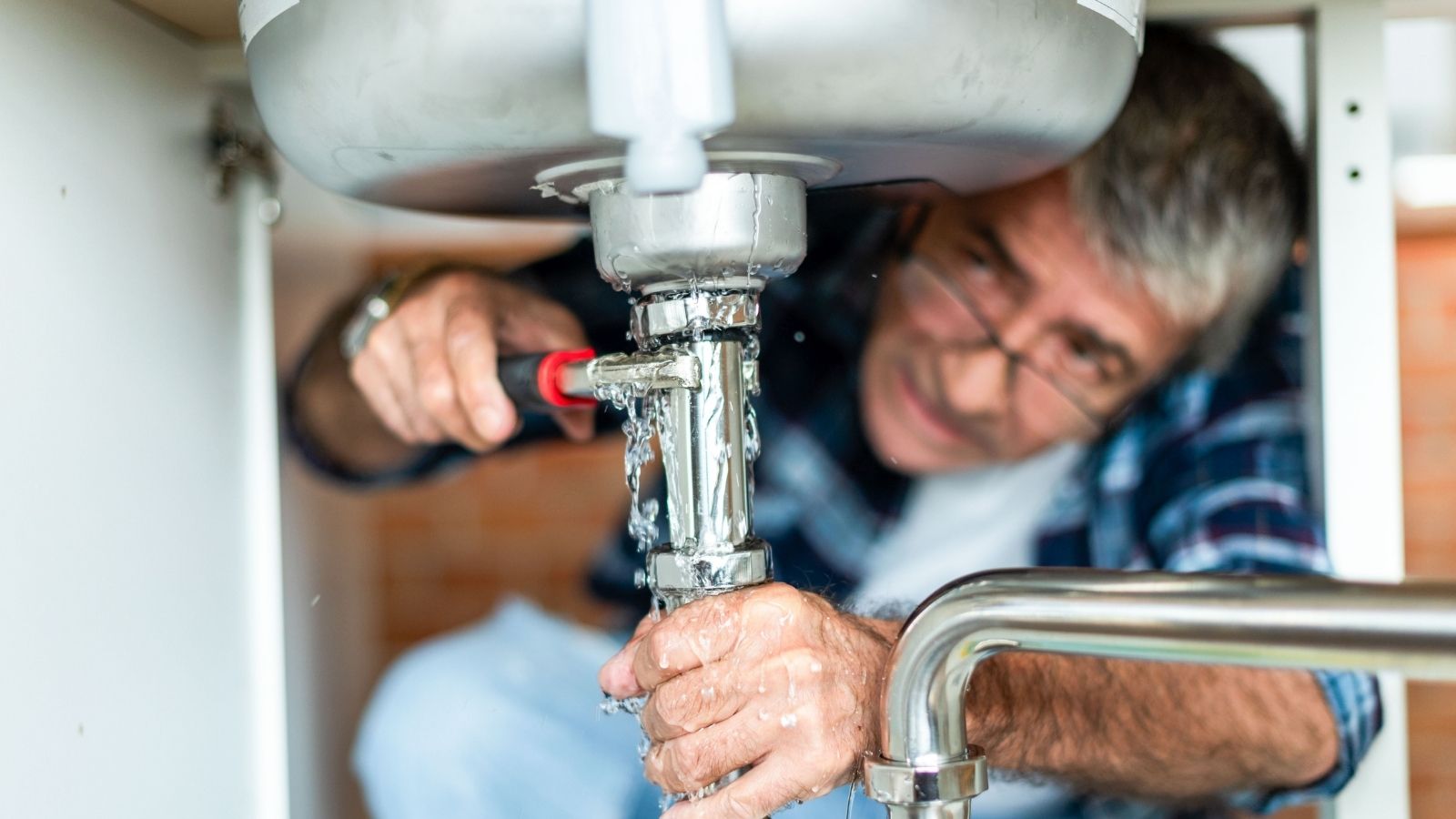 Why a Genius Superintendent Refuses to Touch another Pipe After a Shocking Salary Accusation man fixing a leaky sink