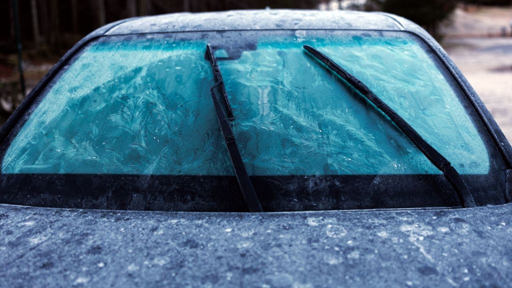 windshield and windshield wipers frozen with ice