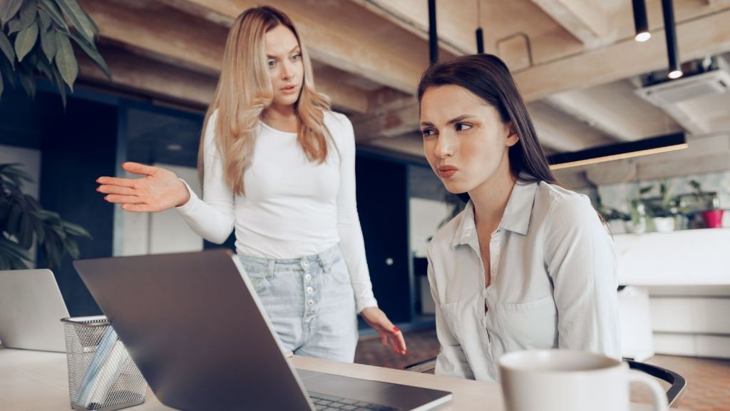 two female coworkers arguing