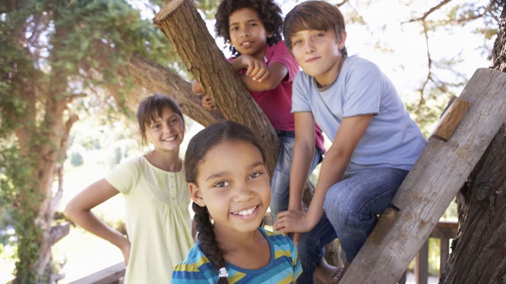 four kids in a treehouse