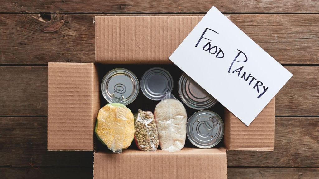 box of food with a sign that reads "food pantry"