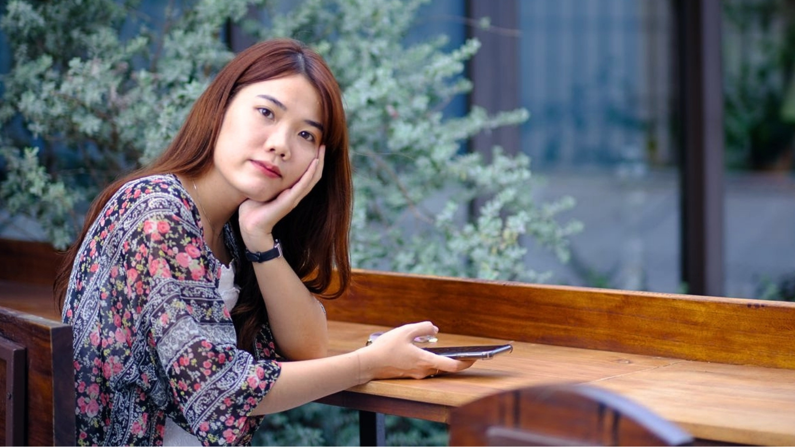 Instagram Interaction Turns Into Heated Argument After Artist Takes Offense at Multiple Likes Upset woman holding phone outside