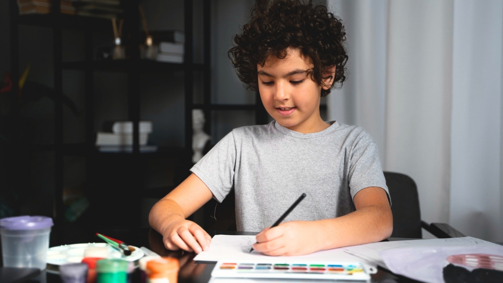 He Needs to Speak for Himself: Family Argument Erupts Over Overbearing Moms Project Interruption Boy painting with watercolor