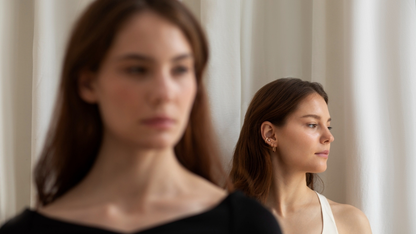 Same Upbringing, Opposite Results: Two Sisters Raised Strict Split Ways on Raising Their Own Kids Two women ignoring each other