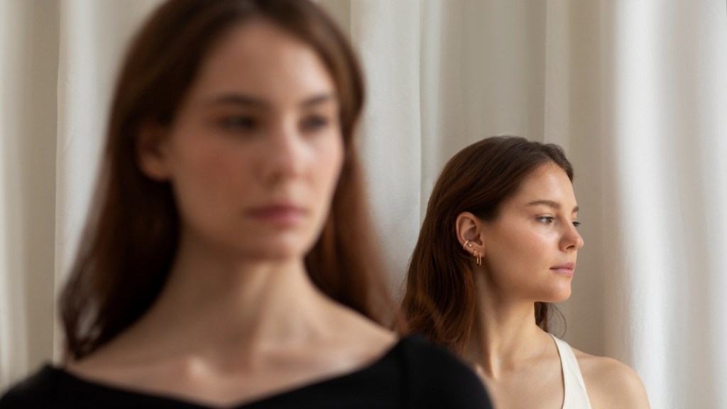 Two women ignoring each other