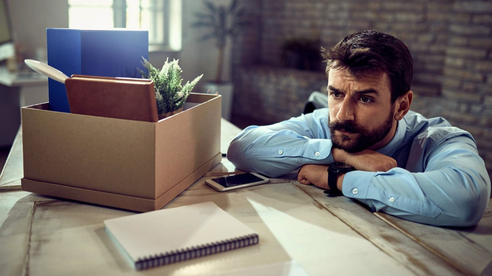 Business man considering quitting his job