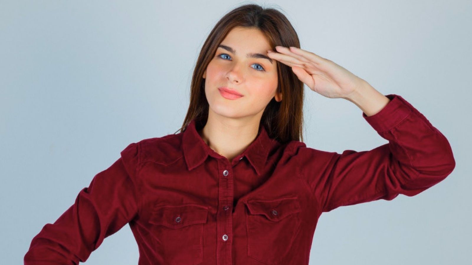 The Ultimate Target Mix Up: Customer Wears Red, Gets Mistaken for Staff, and Actually Starts Working Woman saluting while wearing red