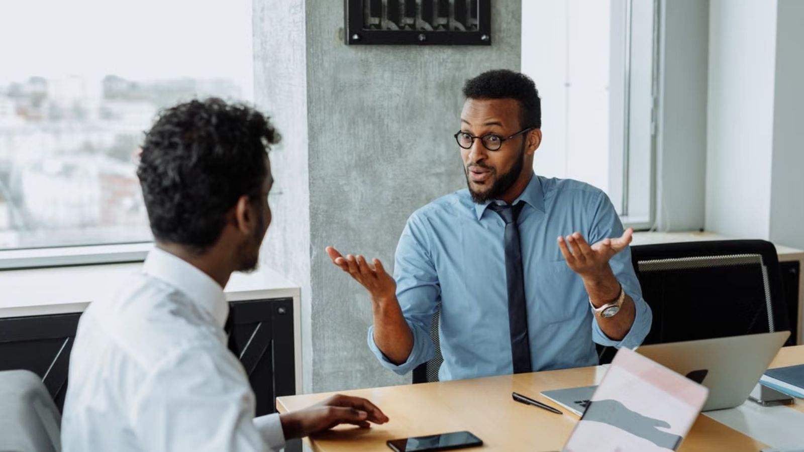 His Employer Expected Patience While Withholding Wages. He Responded by Landing a Better Job Offer. Two employee having a heated discussion in the office