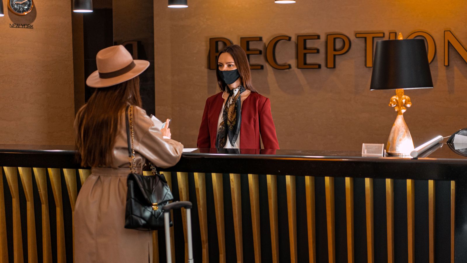 Two women at a hotel reception