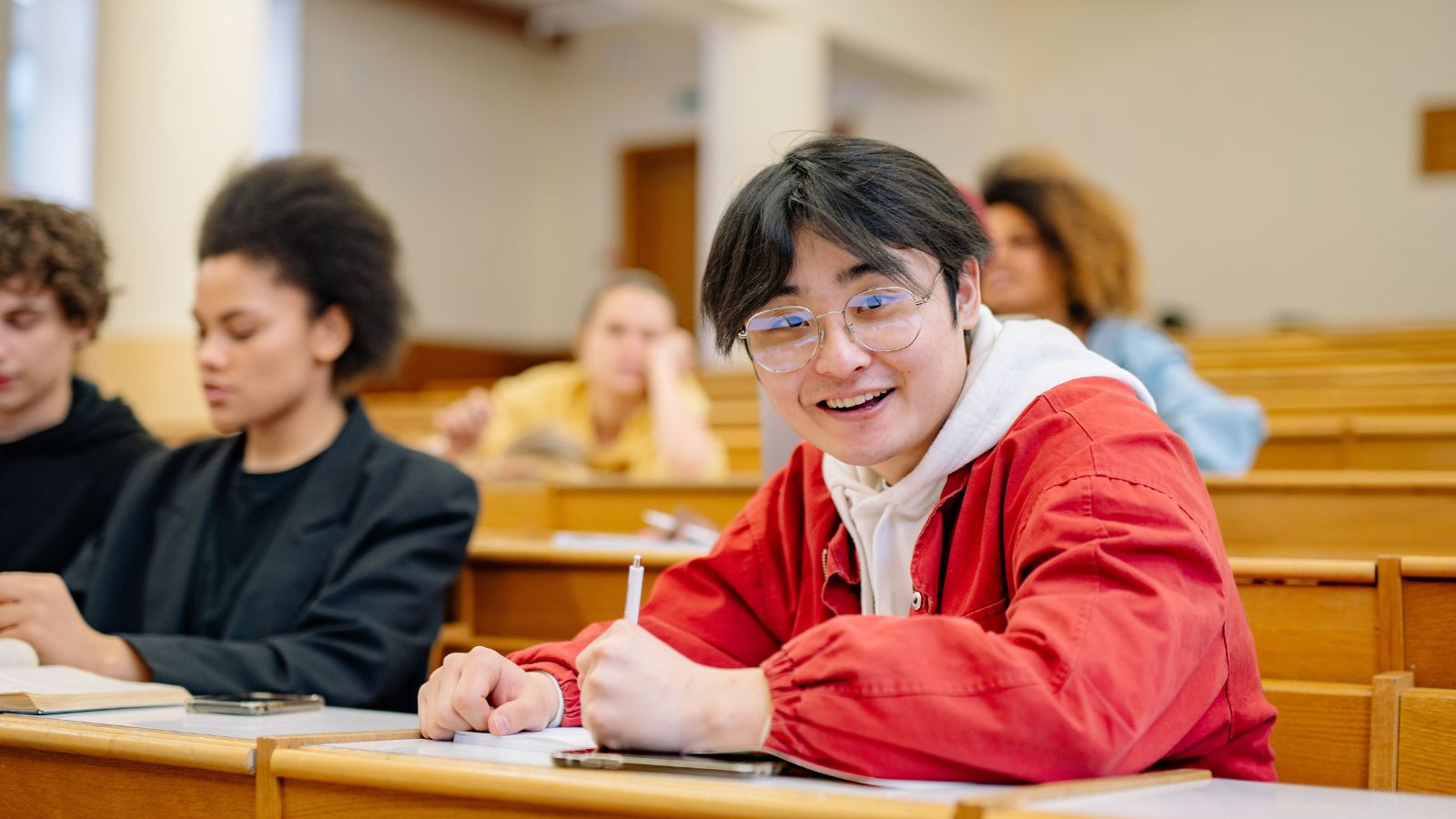 College student in orange hoodie
