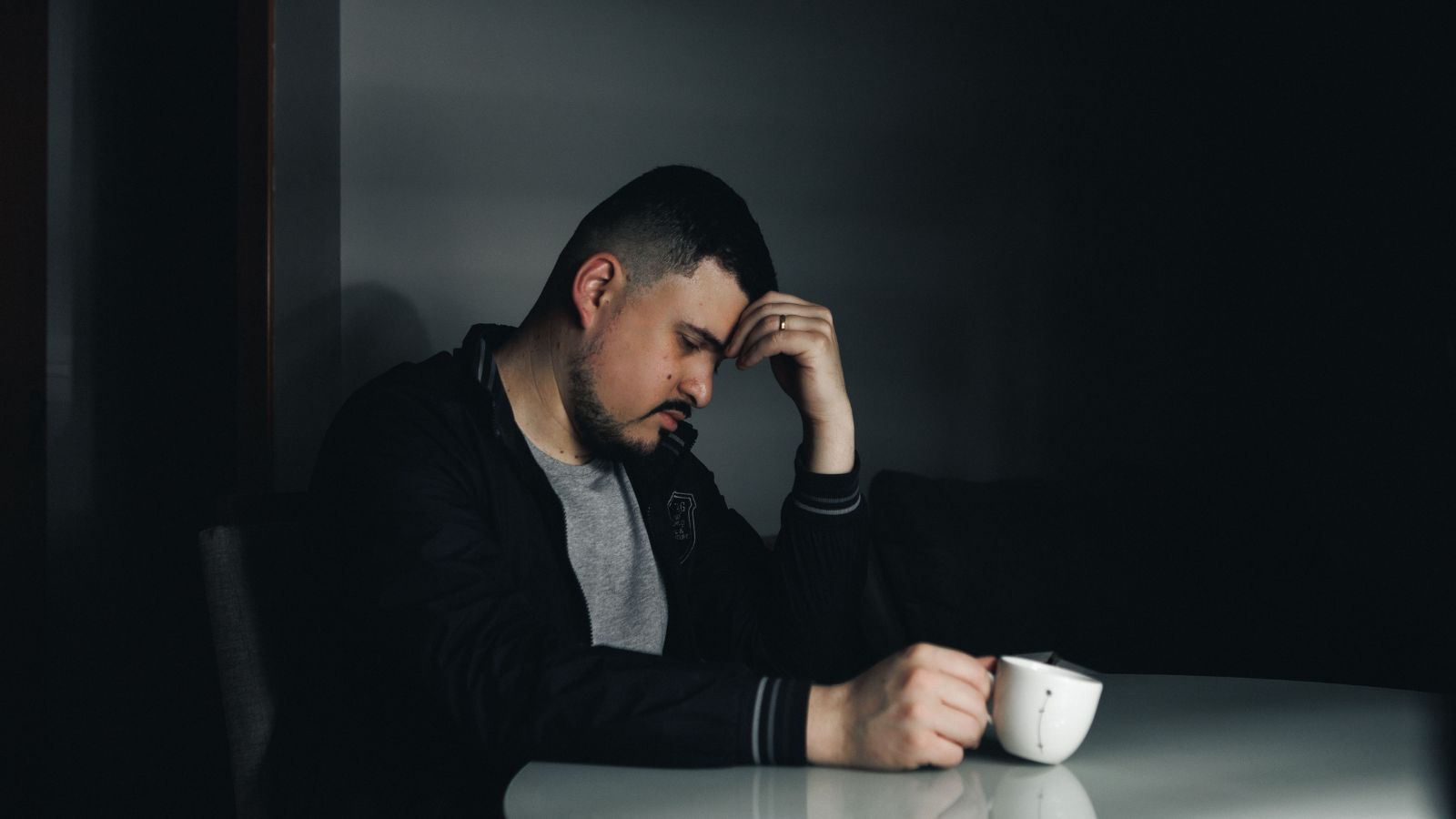 They Shared a Terminal Diagnosis—Then Demanded Their Son Shell Out $11K Every Month Sad man holding his head
