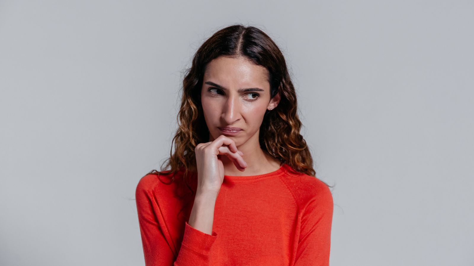 Woman in orange sweater 