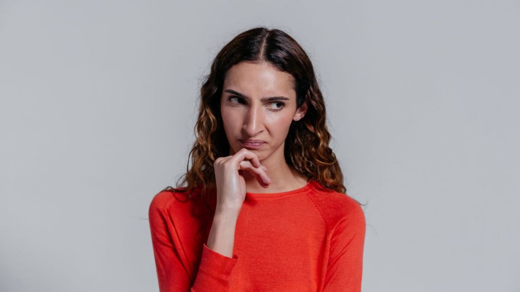 Woman in orange sweater