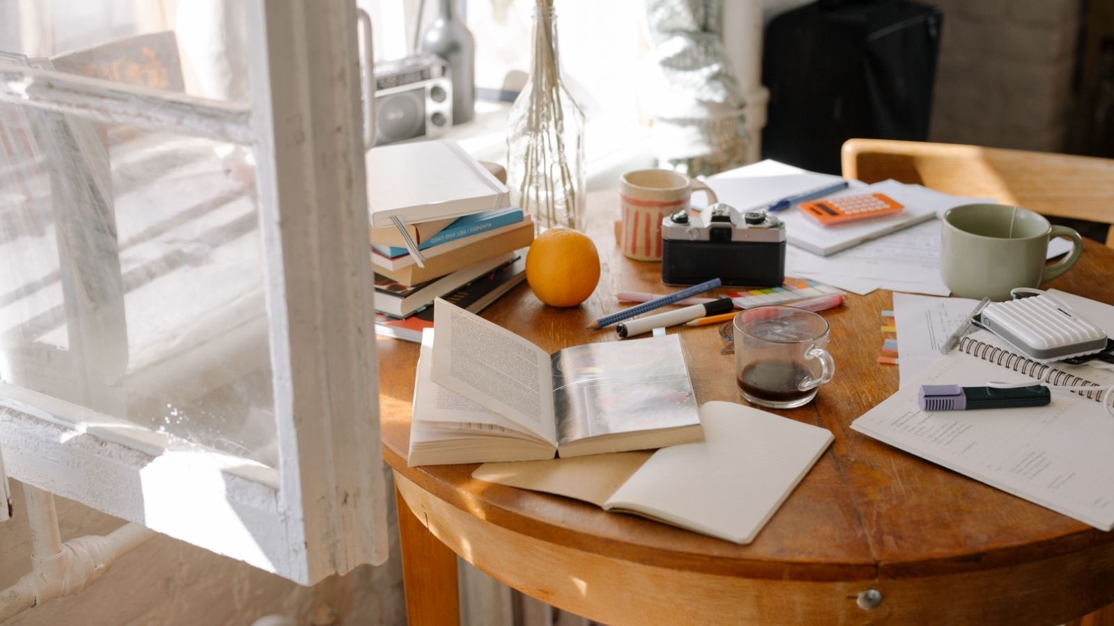 They Moved In Together After Graduation. Now, Her Roommates Obsession With a Spotless Home Has Turned Into a Living Nightmare. A cluttered dining table by open window