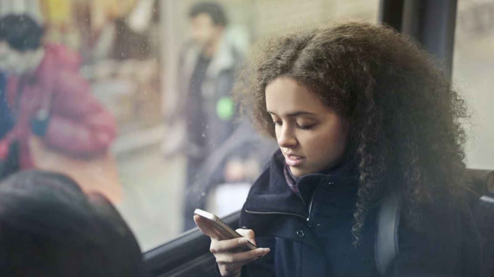 Young Woman Planned To Take A Five Minute Bus Ride—Then Her Stepmom Called Her Lazy Young woman using her phone while riding the bus