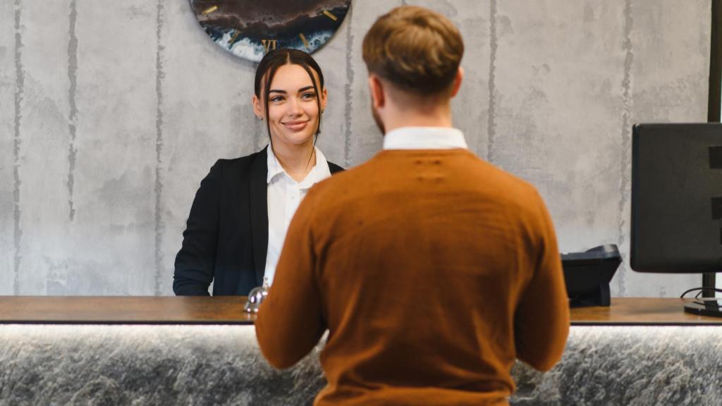 man at a hotel front desk