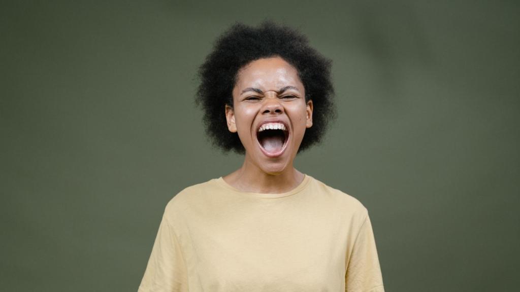angry woman yelling in yellow shirt