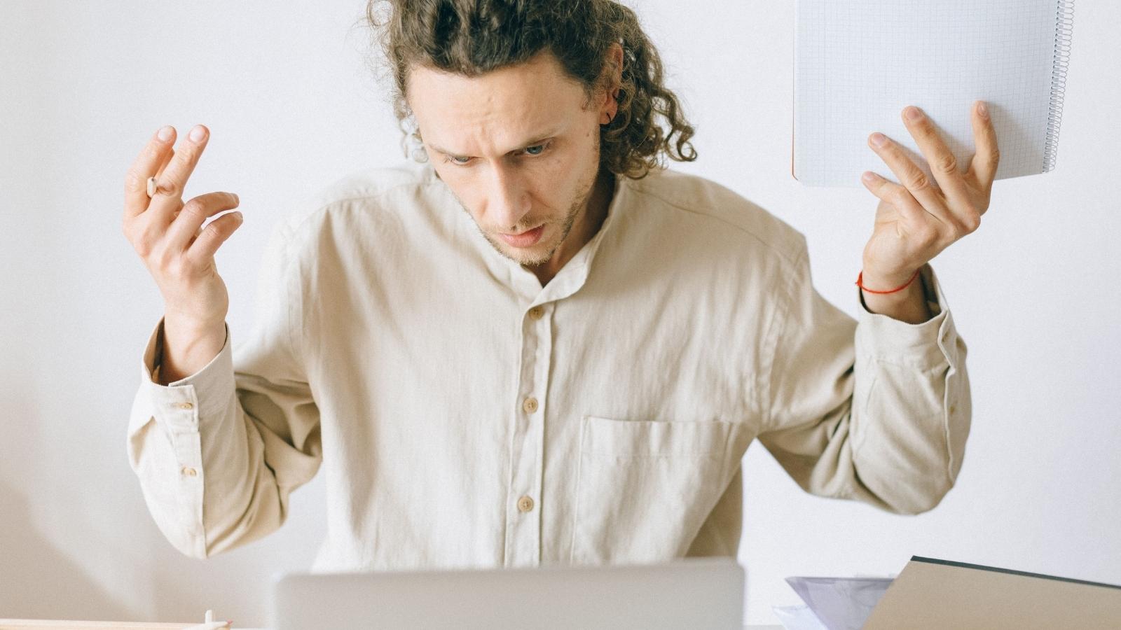 My Job Is on the Line: WFH Employee Reaches Breaking Point Over Unstoppable Noise annoyed man shrugging