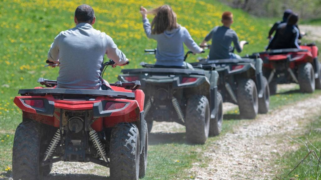 people riding atv vehicles