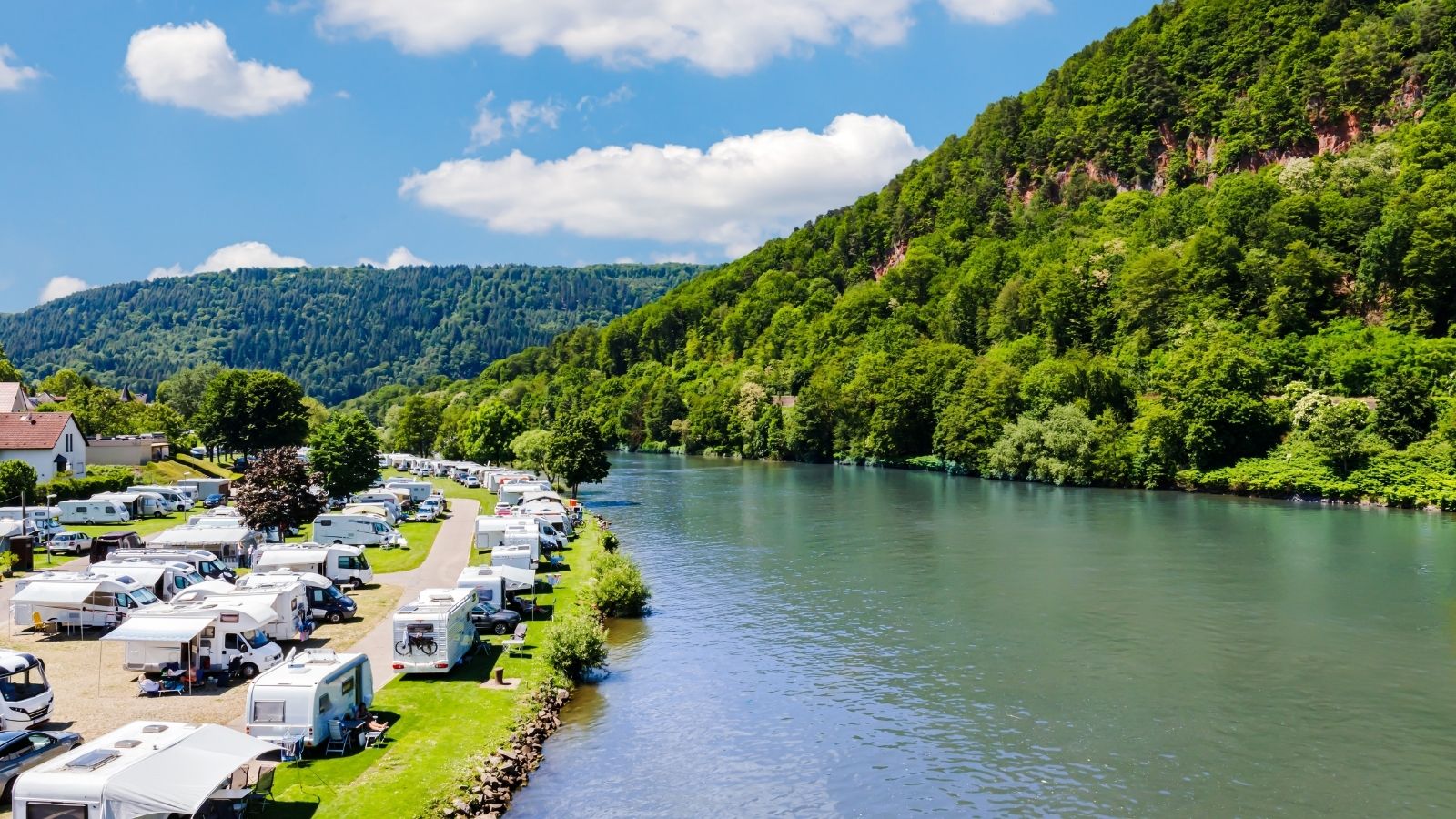 Small Town Campsite Board Faces Lawsuit From Local Caravan Park Over Competition Concerns caravan campsite by river