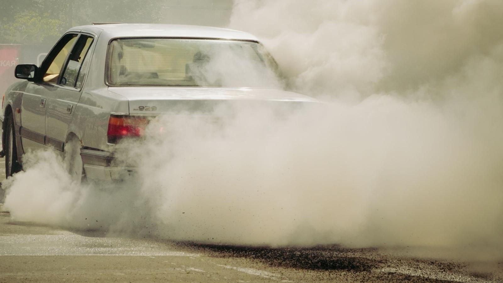 A Car Obsessed Neighbor Is Terrorizing a Suburban Street—And Everyone Is Too Intimidated to Stop Him. car driving fast leaving trail of dust