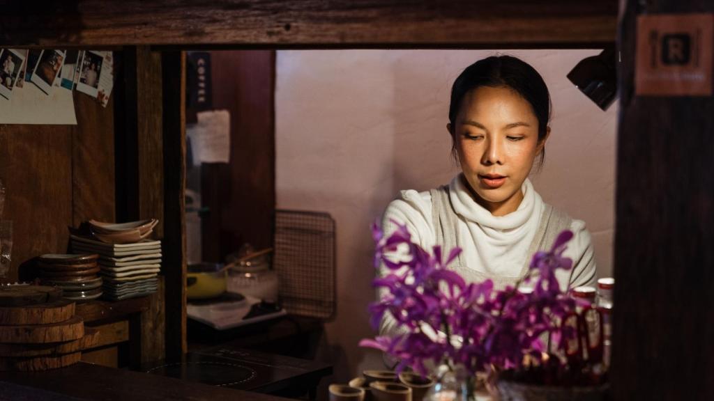 closeup of female server in white