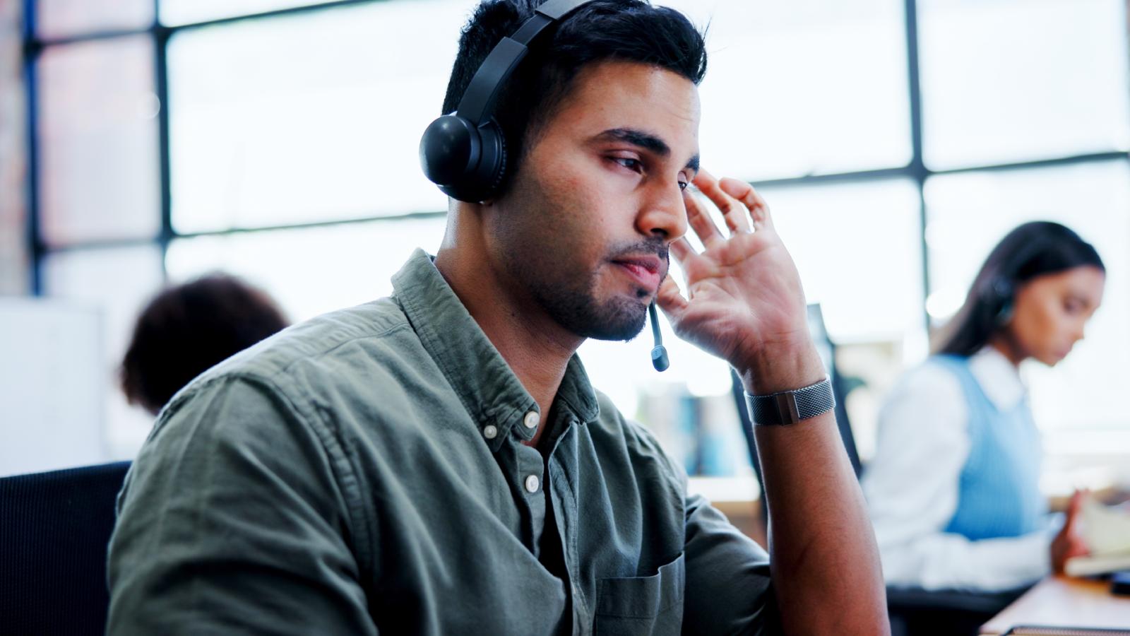 IT Worker Got Frustrated When a Customer Wouldnt Follow Directions During a Software Update man wearing a headset