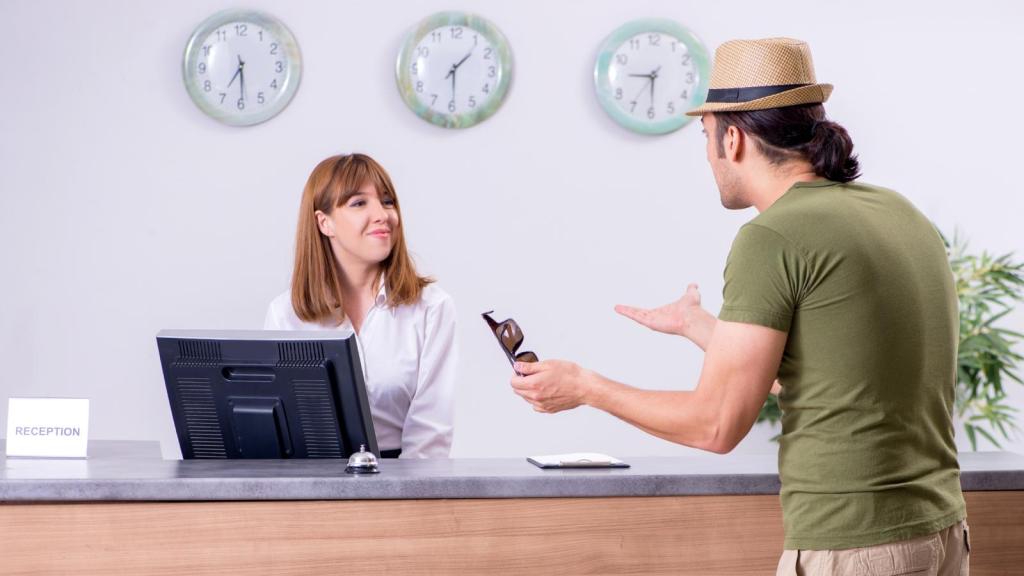 man at hotel front desk