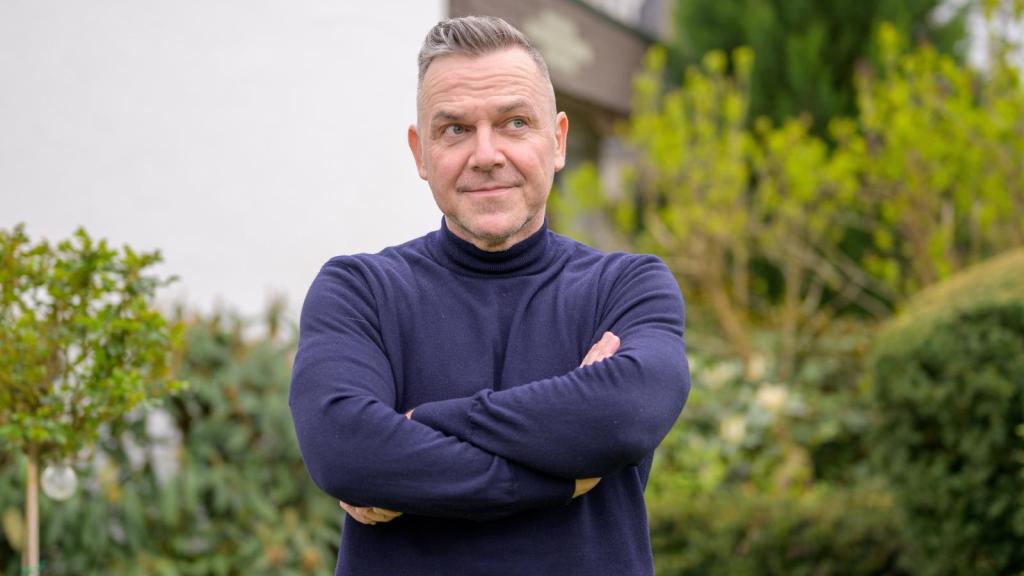 man with his arms crossed
