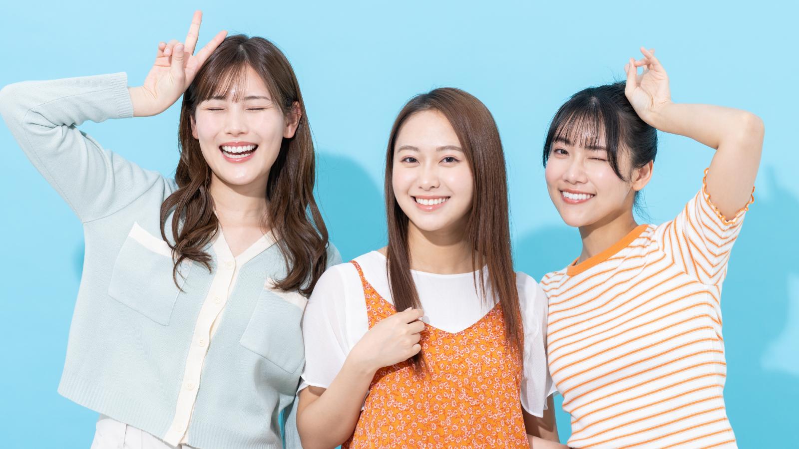 three young women laughing