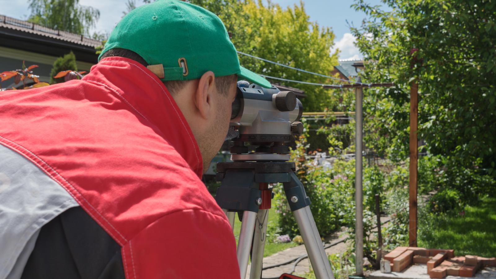 man surveying a property
