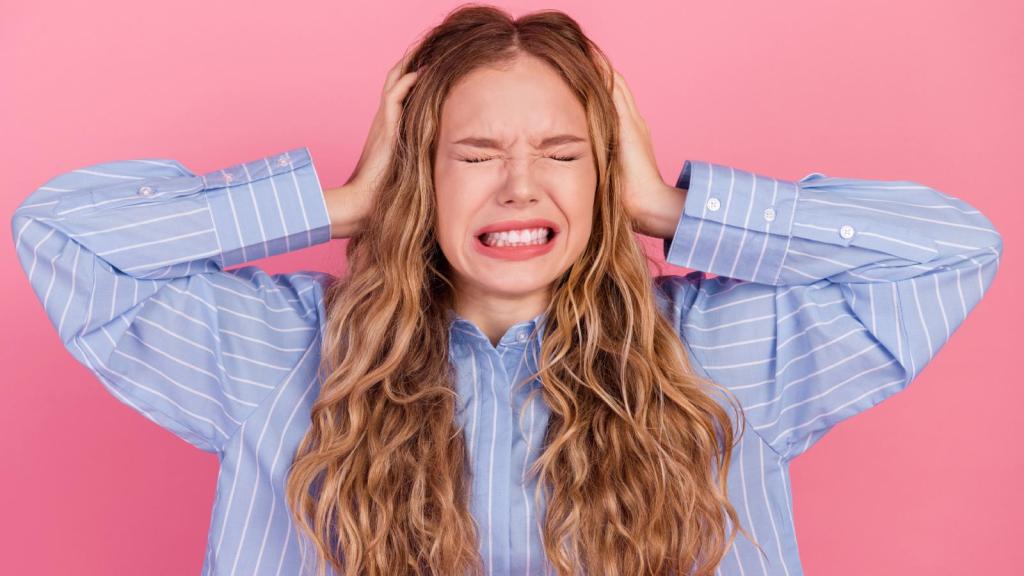 woman plugging her ears