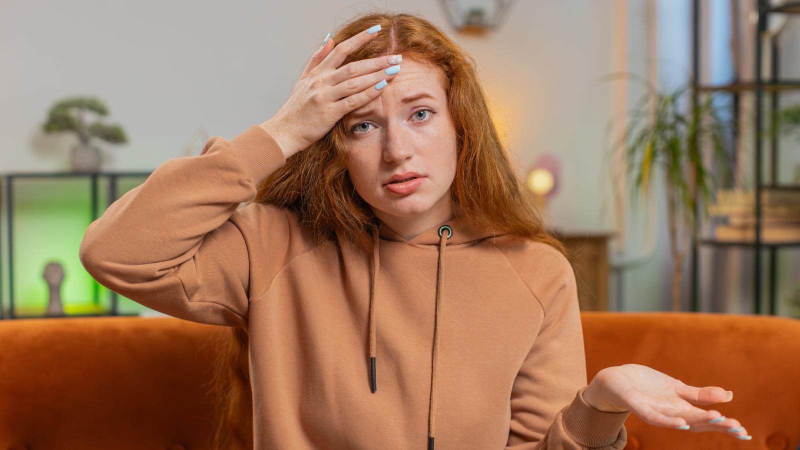 She Opened Her Home as a Favor—Then Her Sister’s Partner Overstayed Their Welcome woman sitting on a couch