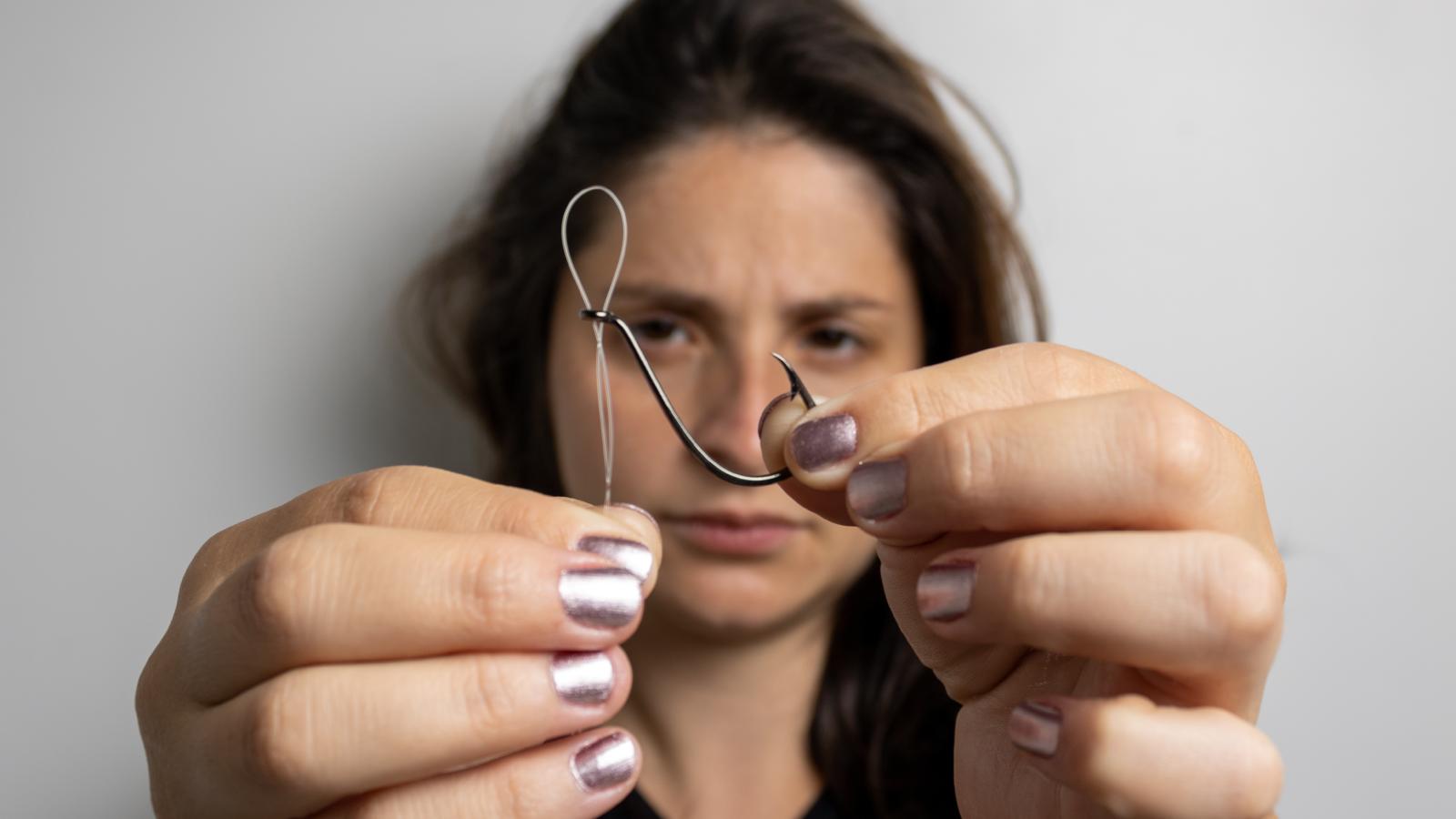 Her Dog Nearly Got Hurt by Fishing Line at the Pond—Now She’s Calling Out the Neighbors woman with a fish hook