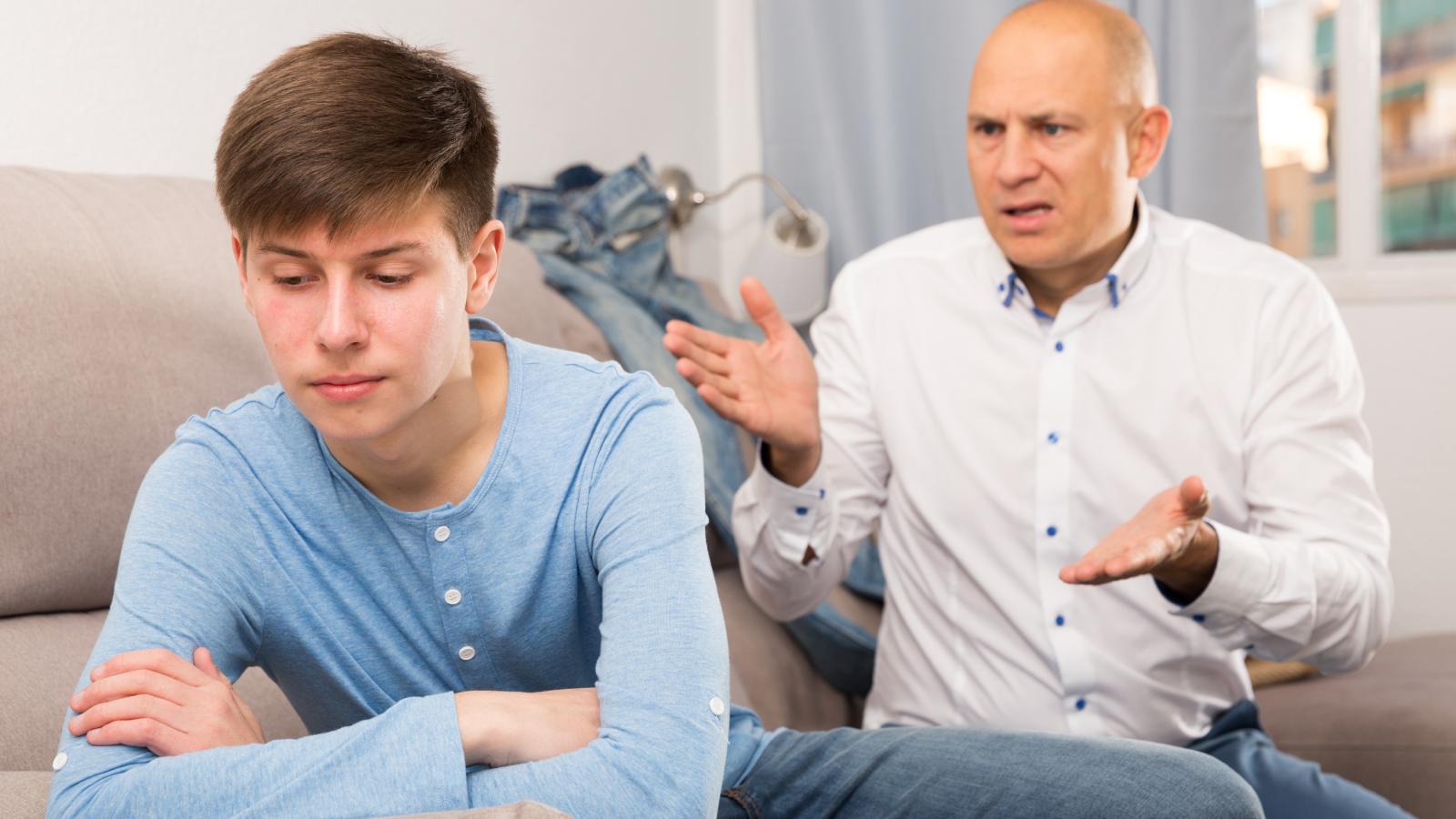 Hand It Over: Dad Demands Teenager Give Him the Free Laptop He Won for Top Grades man arguing with his son