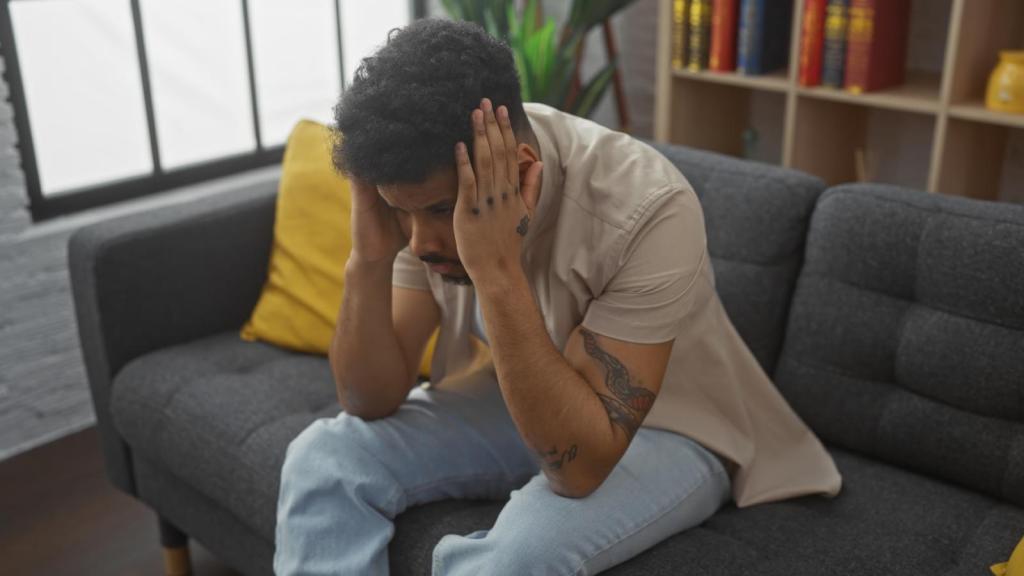 man covering his ears