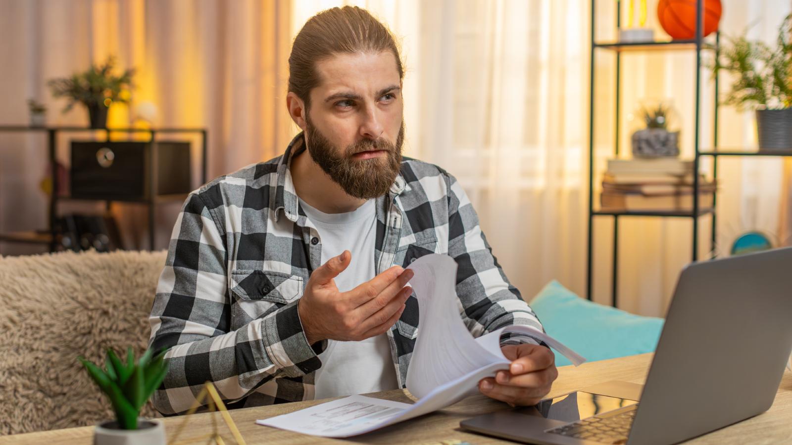 How a Renter’s Hidden Property Discovery Backfired Into the Ultimate Tenant Warning System man looking at a computer