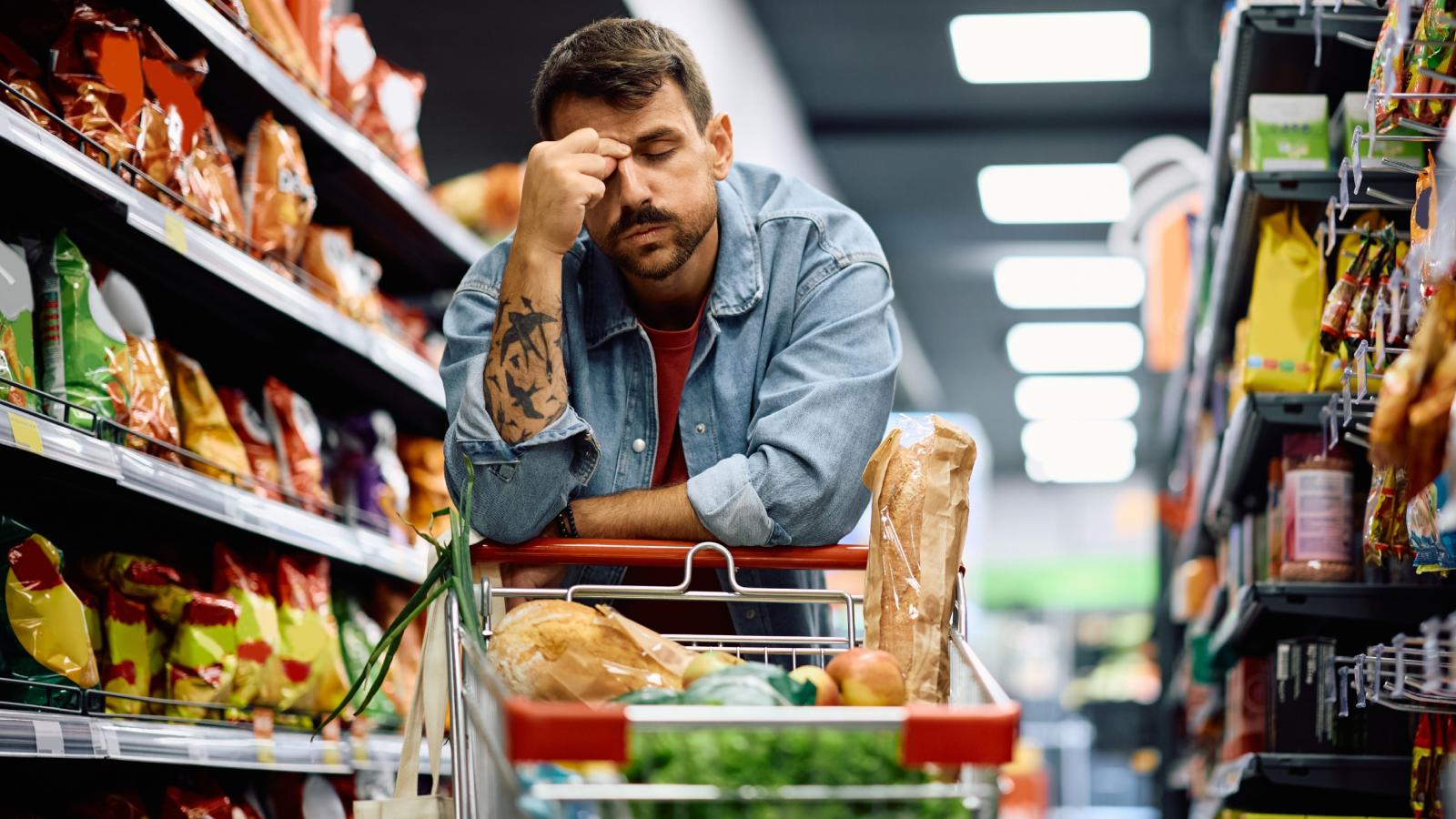 Her Cart Was in the Way at the Grocery Store—Then Another Shopper Bumped It man in a grocery store