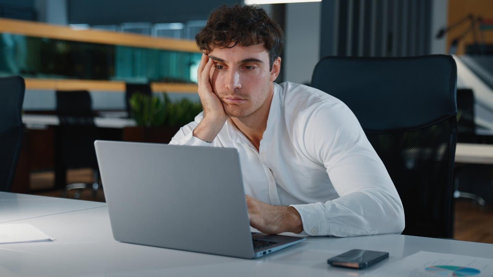 man bored at his desk