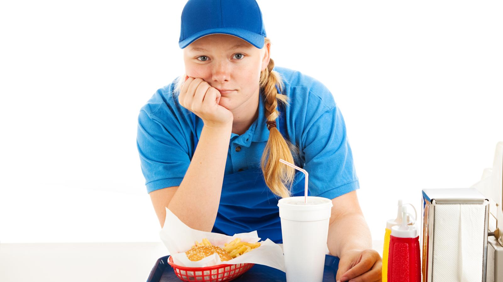 Her Coworker Keeps Bossing Her Around at Work — He Has Zero Managerial Authority — Shes Done Going Along With It woman working at a fast food restaurant