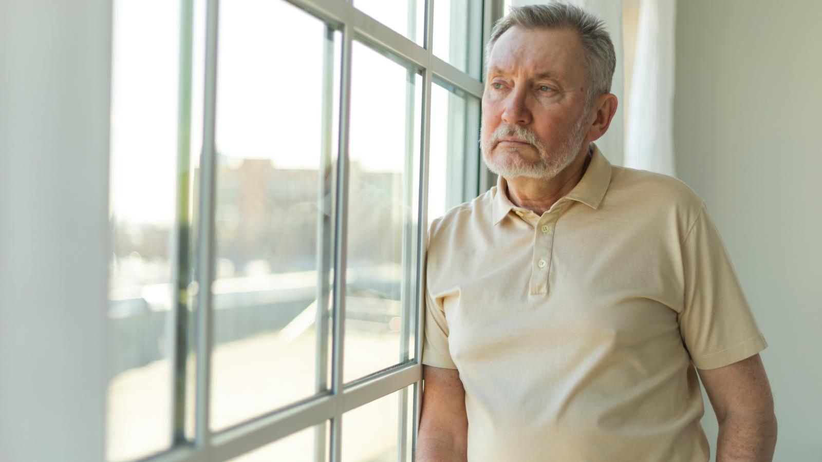 He Says a Wealthy Neighbor’s Property Management Company Is Letting Rude Renters Ruin the Neighborhood—So He May Contact the Owner man looking out a window