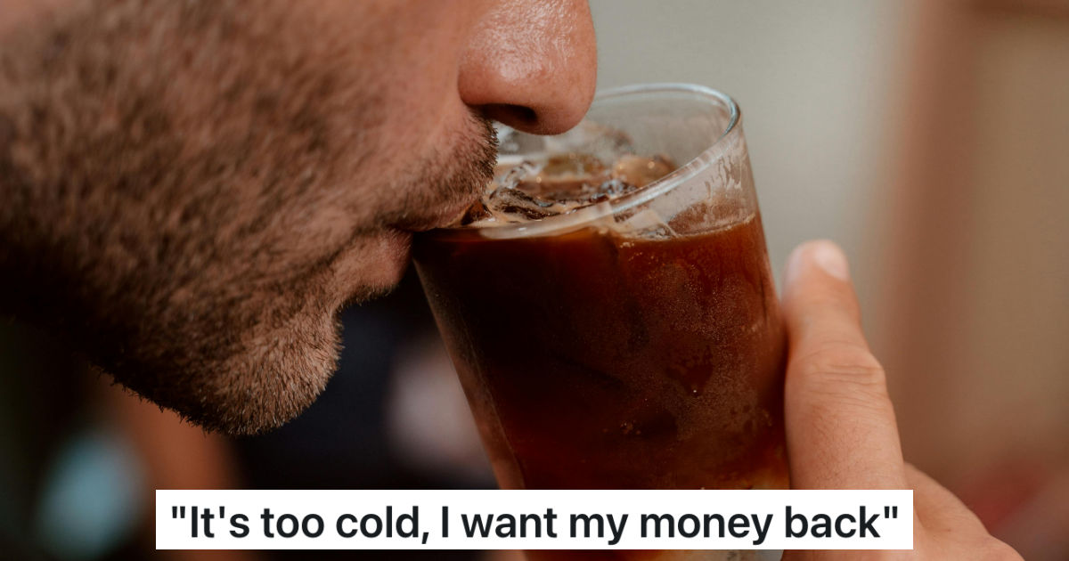 man sipping iced coffee